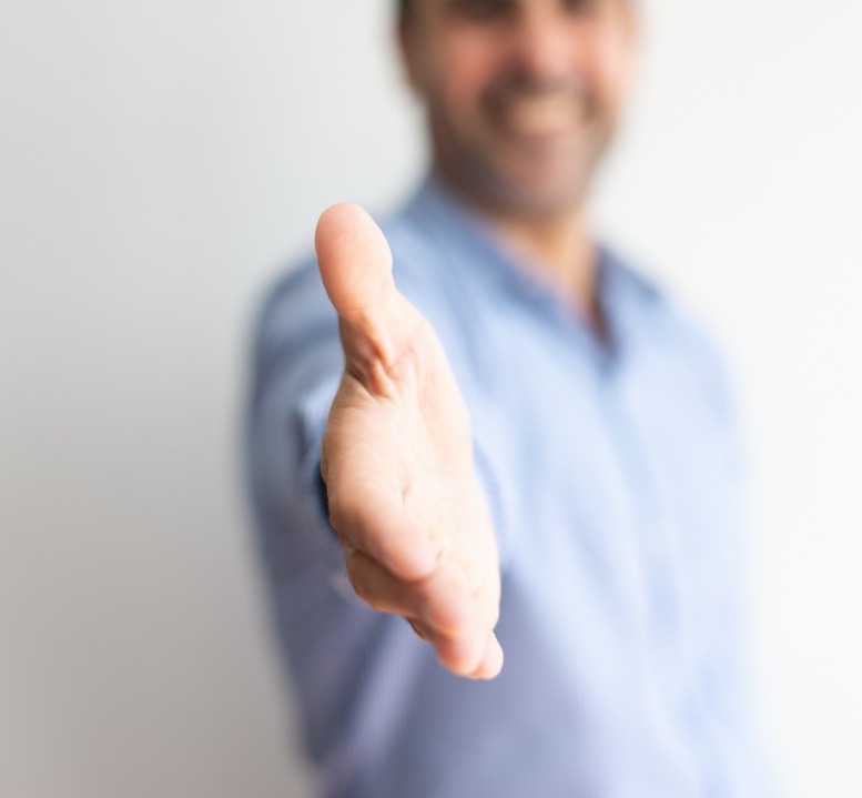 closeup business man offering hand handshake